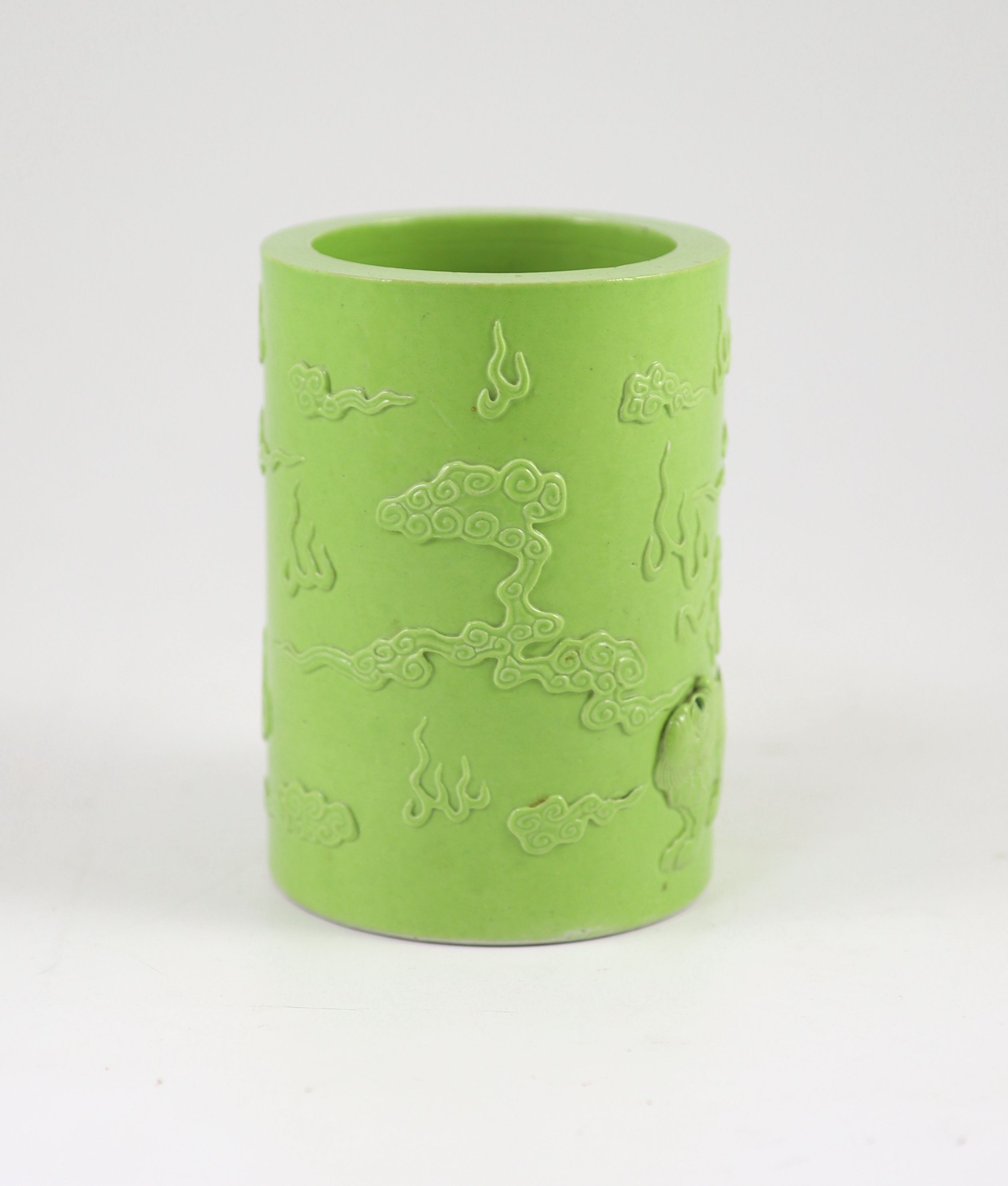 A Chinese lime green glazed brushpot, 19th century, 13.6 cm high, small splinter chip to inner rim